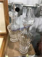 Pair of clear glass wine bottles w/ stoppers