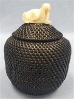 Lidded baleen basket by Carl Hanks with relief car