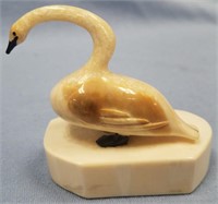 Vintage ivory carving of a swan on walrus ivory ba