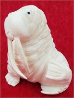 Ivory carving of a walrus by Dennis Pungowiyi 3" t
