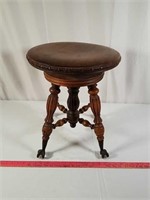 Antique claw foot piano stool.