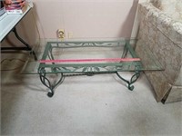 Glass top, wrought iron base coffee table.