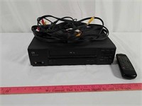 LXI VHS recorder, RCA cables, wireless remote.