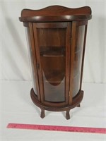 Small antique curio cabinet, bow front.