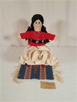 Handmade Native American doll, chair and rug.