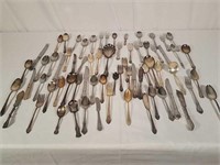 Assorted flatware and silver plate items.