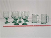Green glassware including Coca-Cola mugs.