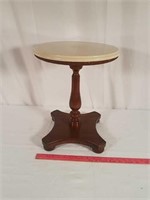 Small table with a cherry finish.