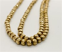 14k carved sliding Gold bead necklace