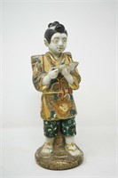 Porcelain asian figurine. Has some damage, see