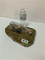 Granite cutting board and ship in the bottle