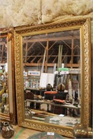 BEVELLED MIRROR WITH ELABORATE GOLD FRAME