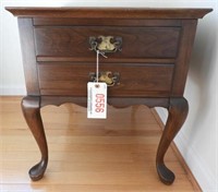 Lot #556 - Cherry two drawer Queen Anne style