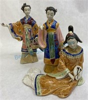 Grouping of three geisha figures