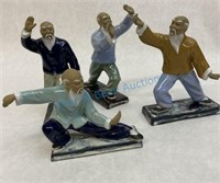 4 figures representing tai chi forms