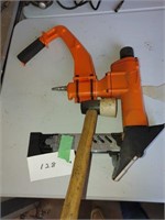 orange hardwood floor nailer with hammer