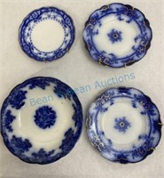 Group of four flow blue plates