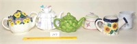 Teapots and a small Pitcher