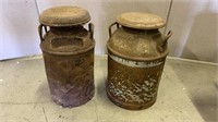 Antique metal milk jugs