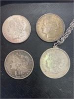 Four Silver  Dollars.