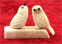 Small ivory carving of 2 owls on a small ivory bas