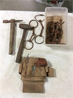 Tool belt, pick, hammer, and horse bits