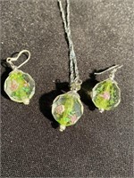 Glass pendant with roses inside on a silver chain