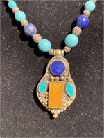 Vintage turquoise and lapis Zuni style pendant.