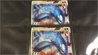 Two  hologram Pokémon cards Kyogre
