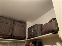 4PC SET OF REVO SUITCASES W SPINNING WHEELS