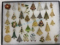 Frame of costume jewelry Christmas tree brooches