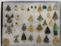 Frame of jeweled Christmas tree brooches