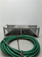 small animal trap and hose