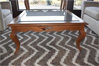 WOOD COFFEE TABLE CARVED SIDES - GLASS TOP 39" X