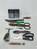 lot of tools- level, pliers, hole punch, etc.