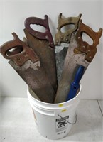bucket with tools- saws, axe, etc.