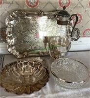 Six pieces - silver plate and glass urn, on a