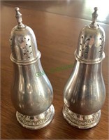 Pair of sterling silver salt and pepper shakers,