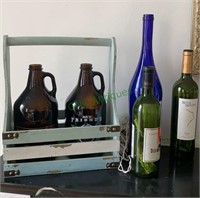 Lot of three wine bottles with white lights