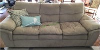 Furniture - tan suede style couch with two pillows