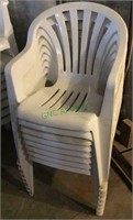 Stackable plastic chairs. A lot of eight white