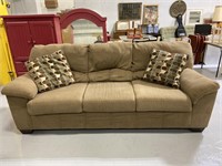 Tan 3-seat couch with matching pillows