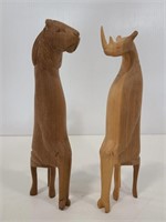Wood carved rhino and lion figures