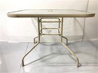 Glass top outdoor table with hole for umbrella