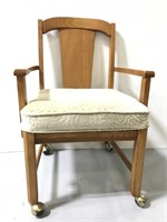 Vintage wood rolling chair with upholstery seat