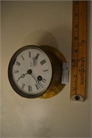 Antique brass clock with key as is 5"diax 3"d