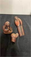 Group of wooden praying statues