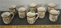 8 matching ceramic mugs