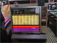 Rock-ola 484 jukebox with some records.