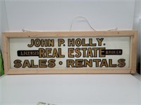 Hand painted real estate sales and rentals sign